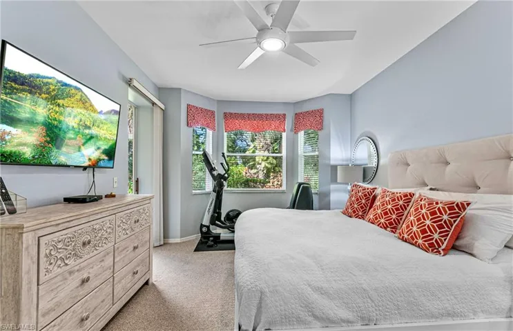 Bedroom featuring ceiling fan and light colored carpet