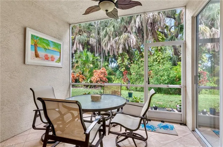 Sunroom / solarium featuring ceiling fan and a wealth of natural light