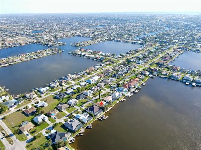 Aerial view with a residential view and a water view