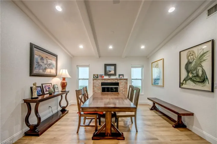 Dining room with a wealth of natural light, beam ceiling
