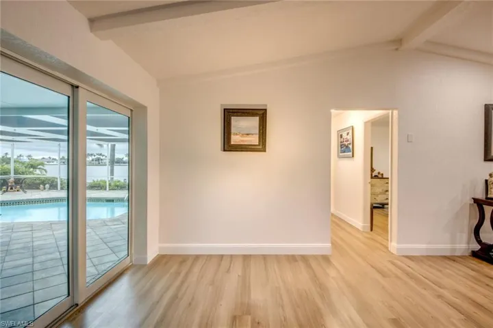 Empty room featuring light wood-type flooring and baseboards