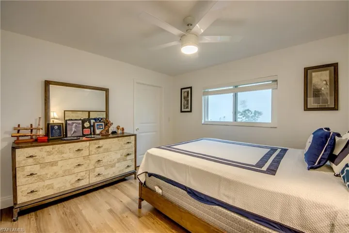 Bedroom featuring ceiling fan and wood finished floors