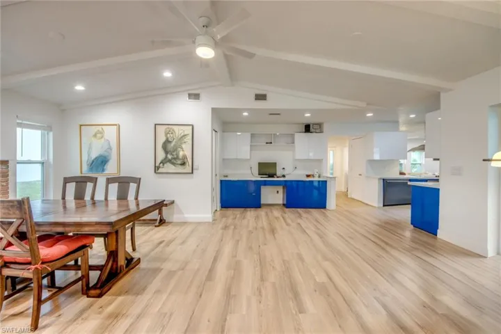 Living room featuring light wood finished floors, ceiling fan, and recessed lighting
