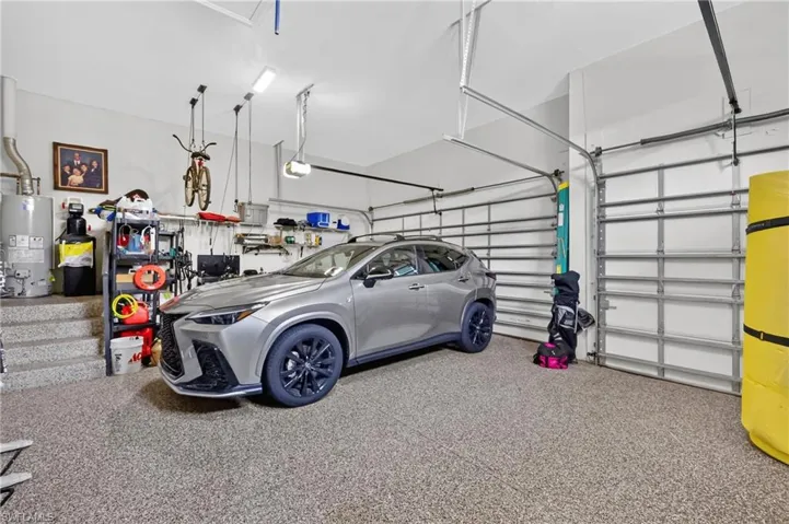 Garage with epoxy floors and 3 car spaces.