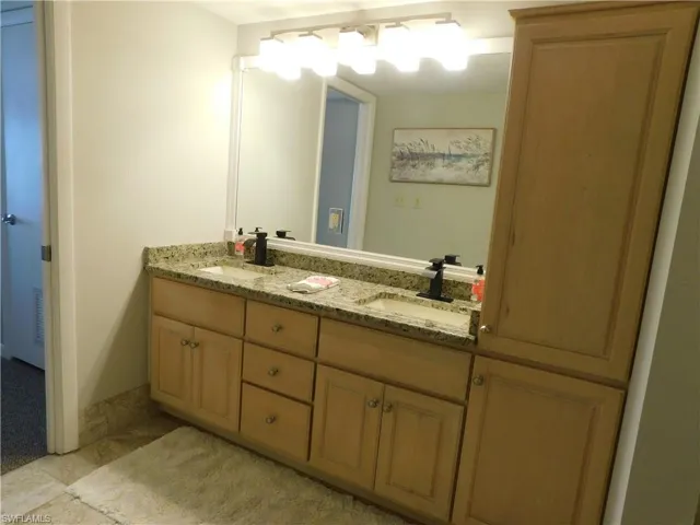 Bathroom with vanity and dual sinks