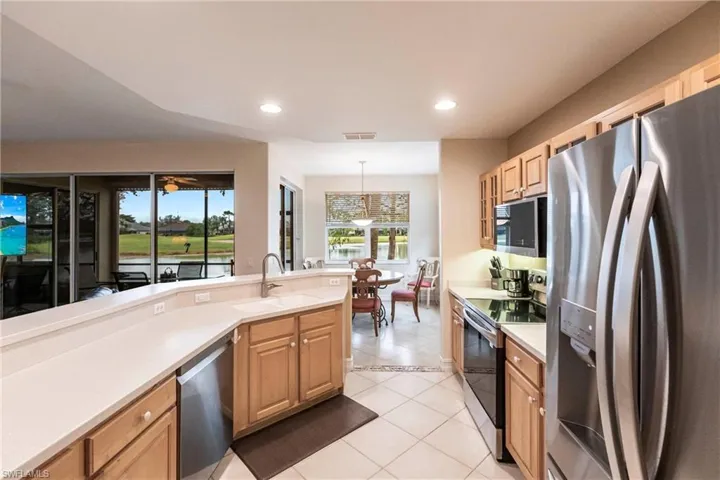 Kitchen with newer SS appliances and view of golf course