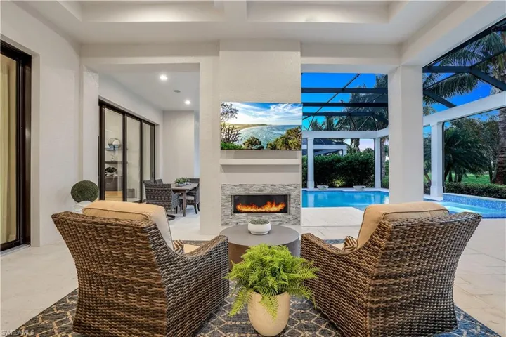 View of patio featuring glass enclosure