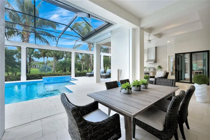 View of pool featuring a patio area, a lanai, an outdoor hangout area, and ceiling fan