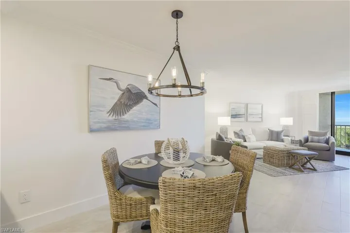 Dining room featuring a chandelier and crown molding