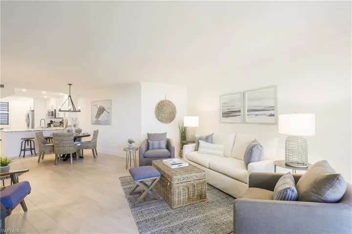 Living room featuring ornamental molding and recessed lighting