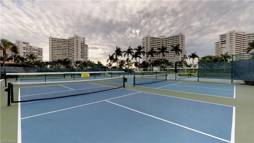 View of tennis court featuring a view of city