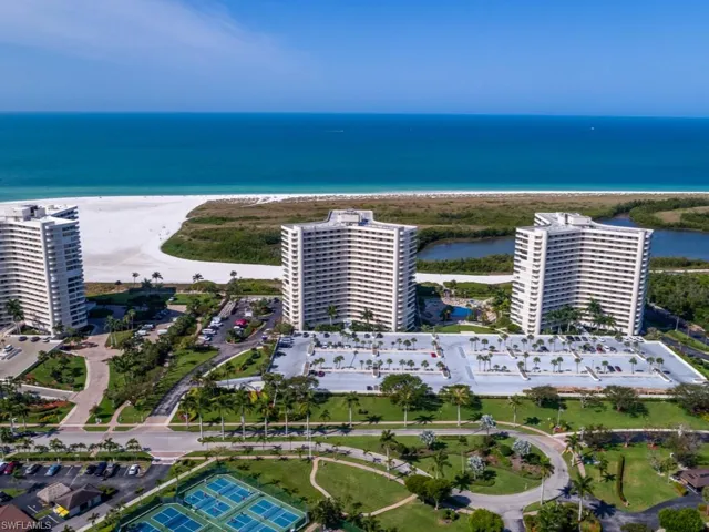 Drone / aerial view of apartment complex and unending shoreline