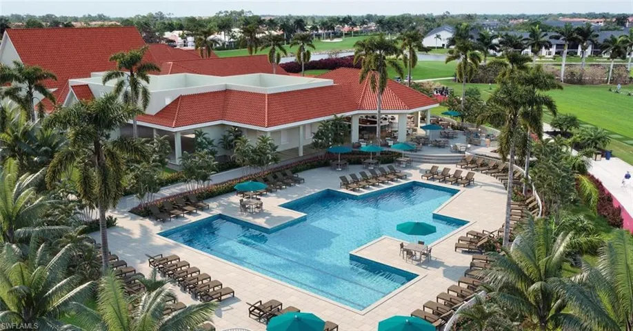 Community pool with fence and a patio area