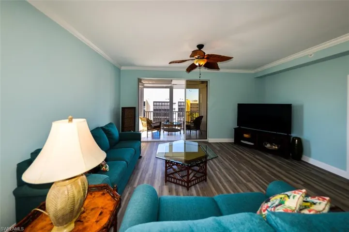 VIEW SHOWING LIVING AREA'S DIRECT LANAI ACCESS.  ENTRANCE TO OWNER'S SUITE IS TO RIGHT.