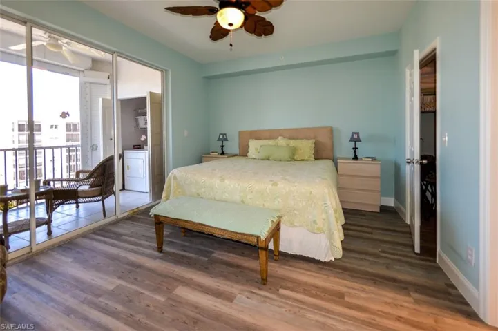 OWNER'S SUITE HAS DIRECT LANAI ACCESS.  WALK-IN CLOSET DOOR IS MID-RIGHT.  ENTRANCE TO EN-SUITE BATH  IS AT RIGHT.