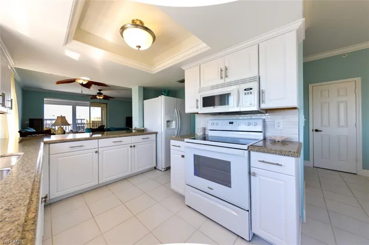 GRANITE COUNTERTOPS.  STAINLESS STEEL UNDER-MOUNT SINK.  TRAY CEILING.