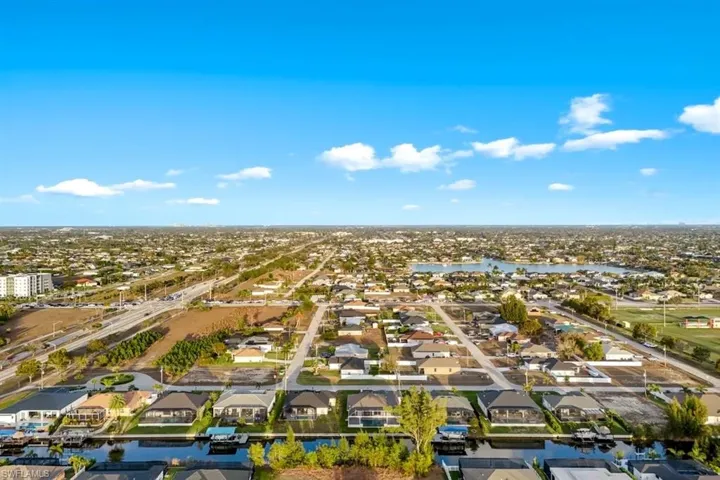 Aerial view of residential area with a large body of water