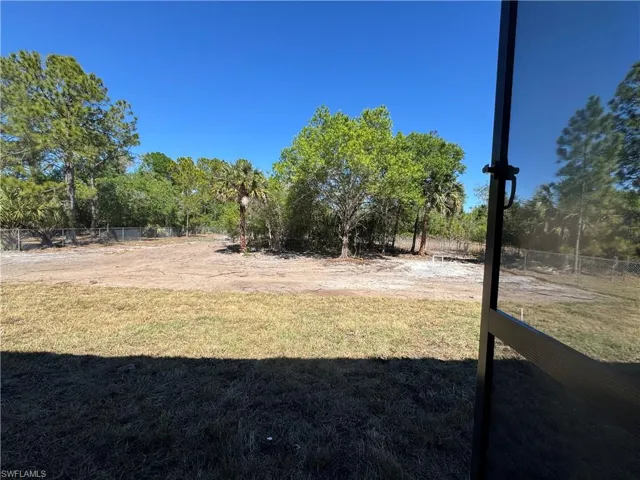 View of yard featuring view of trees