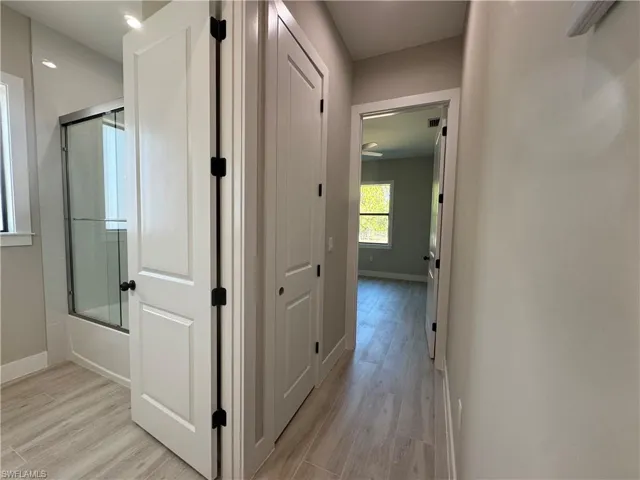 Hall featuring light and baseboards