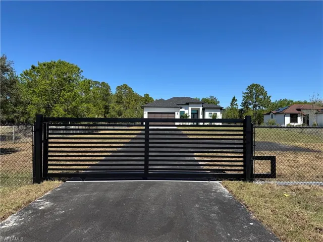 Gate featuring a fenced front yard
