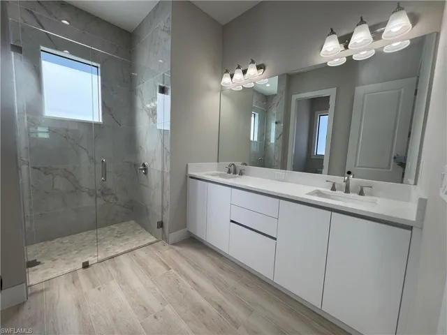 Bathroom featuring double vanity