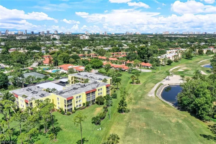 Bird's eye view of a local golf course and city skyline