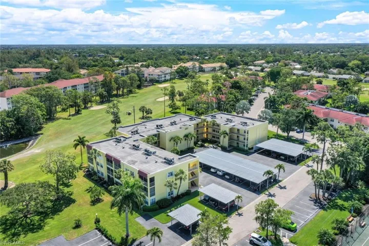 Aerial view of apartment complex and a local golf course