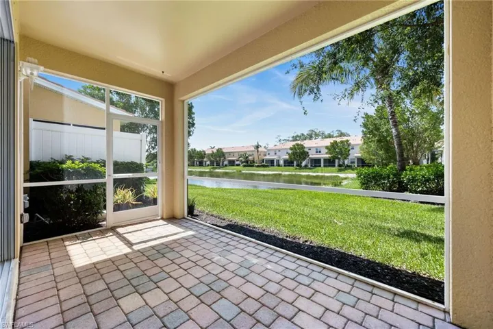 Screened in lanai with a water view and a residential view