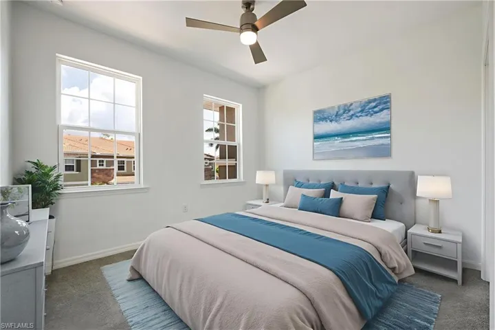 Bedroom with carpet floors and a ceiling fan