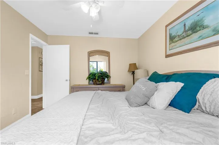Bedroom with a ceiling fan and baseboards