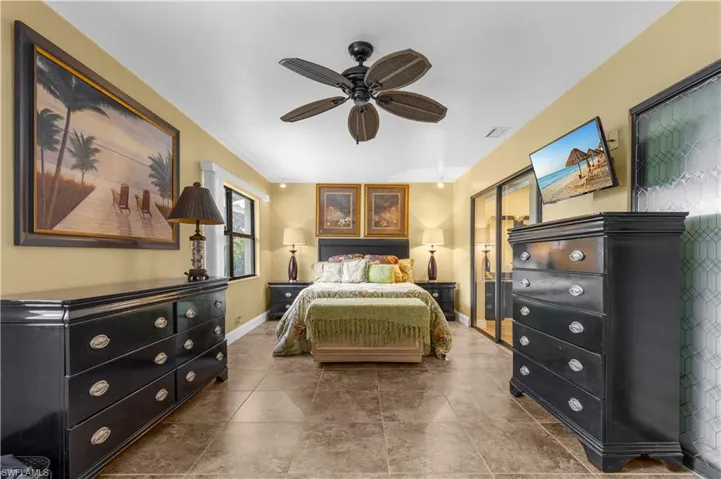 Bedroom featuring baseboards and ceiling fan