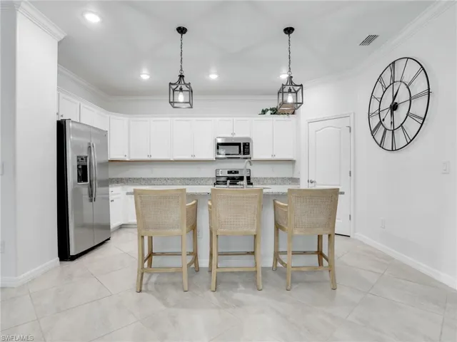 Kitchen w/ granite counters and walk-in Pantry