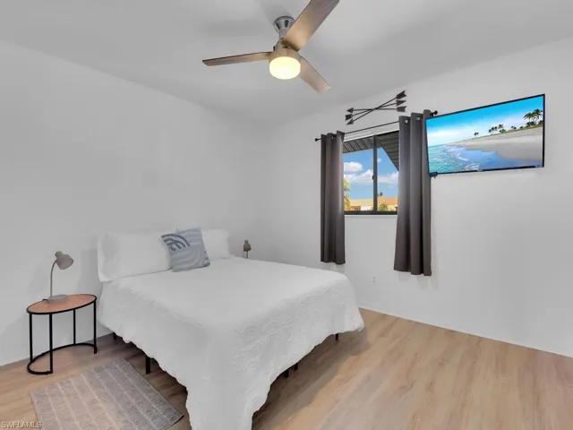 Bedroom featuring light wood-type flooring and ceiling fan