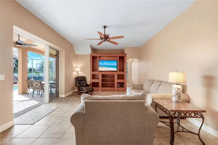 Family room with triple sliding doors to the lanai/pool.