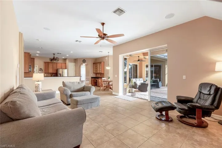 Soaring ceilings, open concept to spacious kitchen and entry to the lanai/pool.