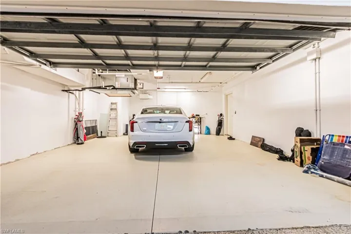 Garage featuring a garage door opener