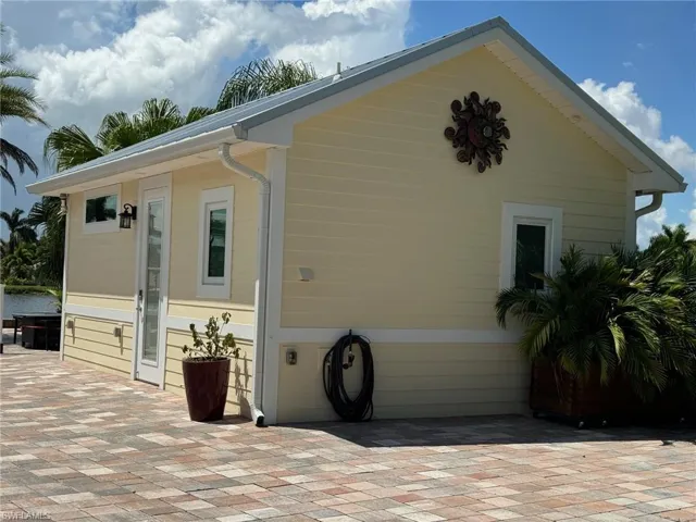 View of side of home with a patio area