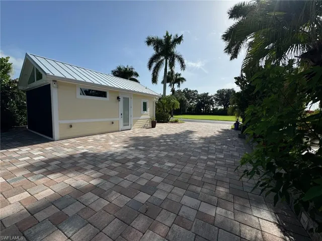 View of patio with an outdoor structure