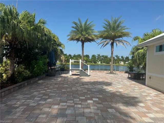 View of patio / terrace with a water view