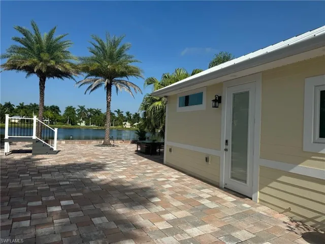 View of patio / terrace with a water view