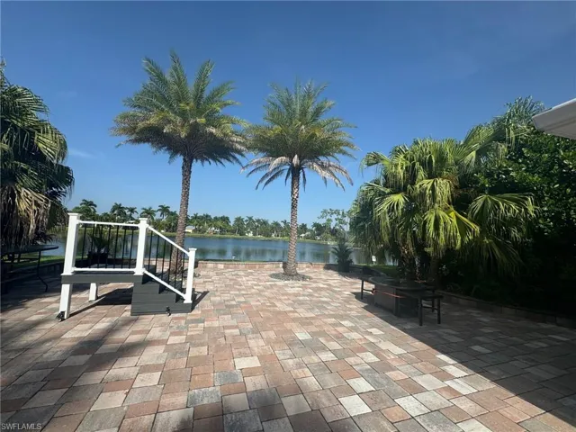 View of patio with a water view