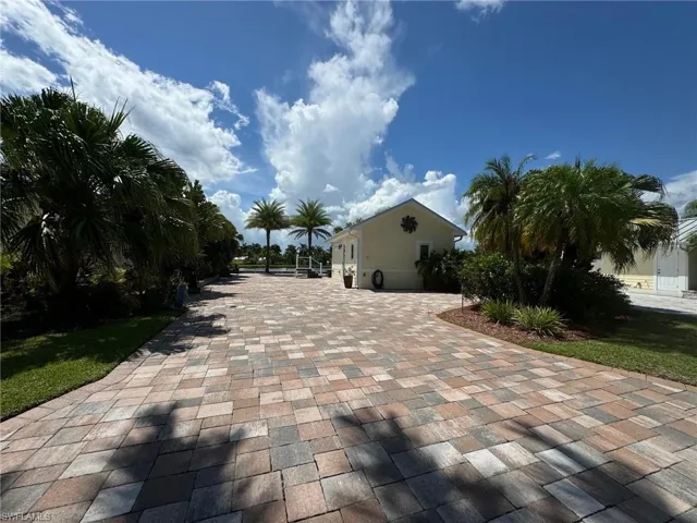 View of property's community with a garage