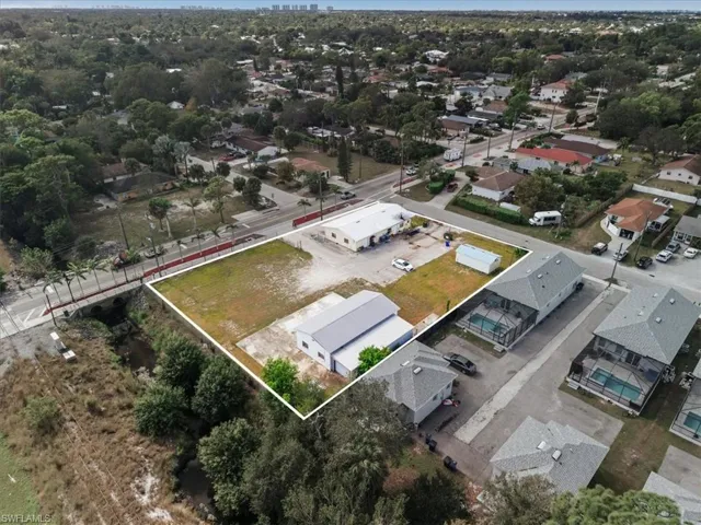 Aerial view of residential area with property parcel outlined