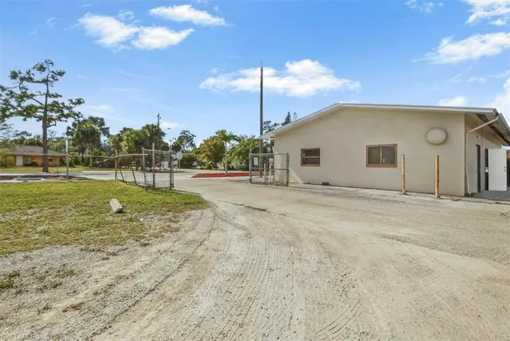 View of dirt / gravel road featuring a gate