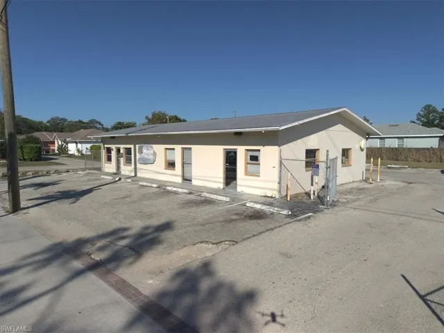 Bungalow-style house featuring stucco siding