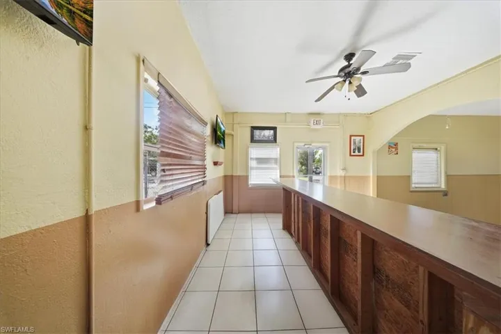 Hall with light tile patterned floors