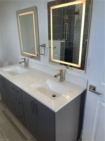 Full bathroom with double vanity