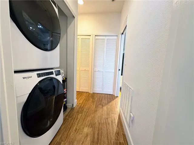 Guest hallway with the laundry and additional storage closet.