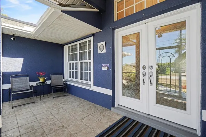 Oversized screened enclosure in front of house