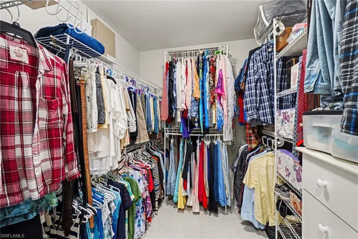Large walk-in closet with pocket door